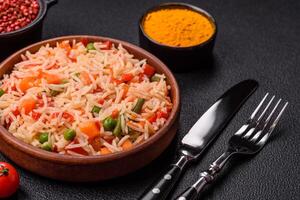 Boiled rice with vegetables, salt and spices photo