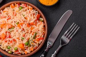 Boiled rice with vegetables, salt and spices photo