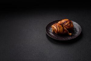 Delicious grilled chicken legs with spices and herbs in teriyaki sauce photo