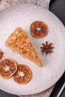 Piece of sweet layer cake Napoleon with custard photo