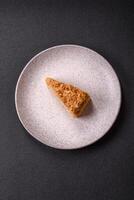 Piece of sweet layer cake Napoleon with custard photo