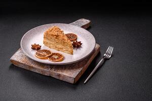 Piece of sweet layer cake Napoleon with custard photo