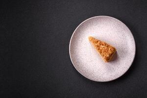 Piece of sweet layer cake Napoleon with custard photo