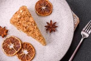 Piece of sweet layer cake Napoleon with custard photo