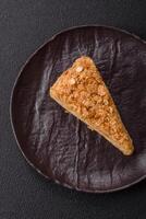 Piece of sweet layer cake Napoleon with custard photo
