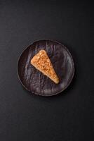 Piece of sweet layer cake Napoleon with custard photo