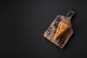 Piece of sweet layer cake Napoleon with custard photo