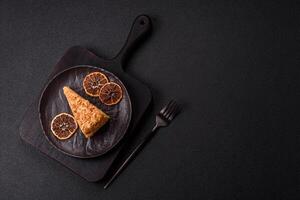 Piece of sweet layer cake Napoleon with custard photo