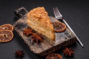 Piece of sweet layer cake Napoleon with custard photo