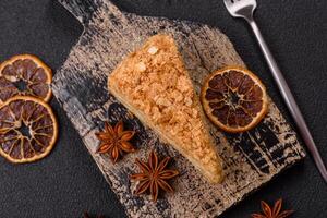Piece of sweet layer cake Napoleon with custard photo