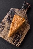 Piece of sweet layer cake Napoleon with custard photo