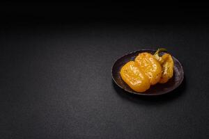 Yellow sweet pepper cut in half and grilled with salt, spices and herbs photo