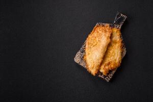 Grilled chicken or turkey chop with salt, spices and herbs photo