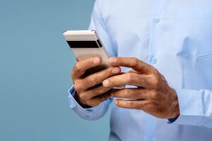 Closeup, middle aged man holding mobile phone, using mobile app selective focus on hands photo