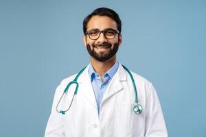 Smiling, Indian bearded man, doctor wearing stylish eyeglasses, looking at camera and white coat photo