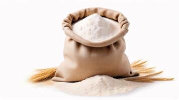 A burlap sack filled with white flour and surrounded by wheat stalks on a white background. photo