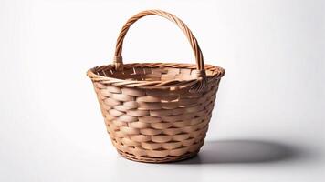 Empty wicker basket with a handle on a white background. photo