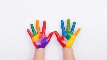 Two colorful handprints on white background. photo