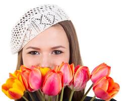 Cute girl in parisian style with tulip flowers photo