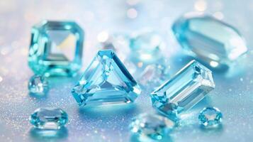 Various blue gemstones of different shapes and sizes are arranged aesthetically on a sparkling background. The stones capture light, creating a dazzling effect and highlighting their unique features. photo