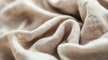 Close-up of beige linen fabric texture in soft folds photo