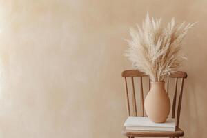 Minimalist beige interior with rustic vase and dried pampas grass on wooden chair photo