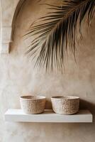 Minimalist decor with woven baskets on shelf and palm leaf accent photo