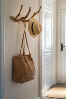 Rustic hallway with straw hat and woven bag on wooden hook photo
