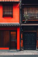Traditional red japanese building with wooden doors and windows photo