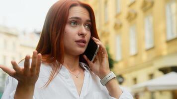 Angry displeased frustrated woman mad annoyed lady female businesswoman girl tourist in city talk mobile phone emotional customer shout conversation cellphone business chat argue smartphone outdoors photo