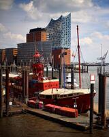 HAMBURG, GERMANY - JUNE 27 2021 Lightship and Elbphilharmonie at the port of Hamburg photo