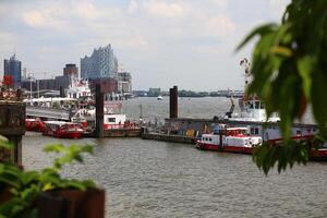 HAMBURG, GERMANY - JUNE 27 2021 Various ships landing at the port of Hamburg photo