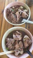 Savory traditional soup bowl local market food photography rustic setting close-up culinary delight photo