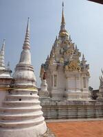 Cultural heritage exploration white temple architecture thailand travel photography sunny environment detailed viewpoint photo
