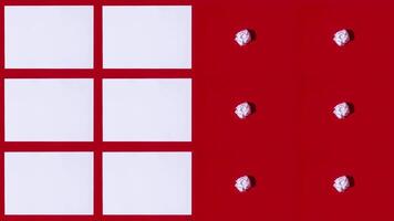 Sheets of A4 paper appear on a red background video