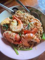 Delicious noodles with shrimp local market food photography rustic setting close-up view culinary delight photo