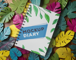 mockup of white diary in the middle of colored sheets psd