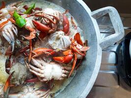 Top View of Crabs Being Boiled in a Pan photo