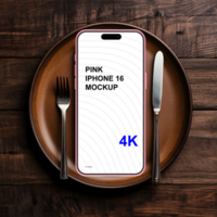 Pink smartphone mockup on the plate with fork and knife psd