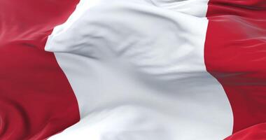 Peru flag waving at wind with blue sky in slow, loop video