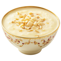 A bowl of creamy white soup with nuts on top png