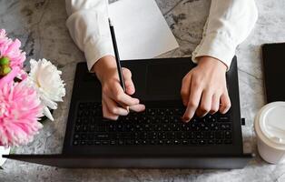 A person is using a laptop. photo