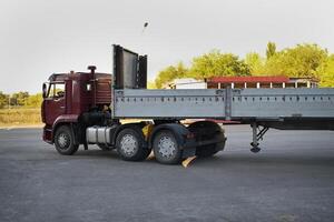 An empty truck with sides is ready for loading photo