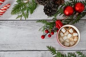 A red wooden Christmas tree ornament with white hearts is placed in the top right corner of the image. photo