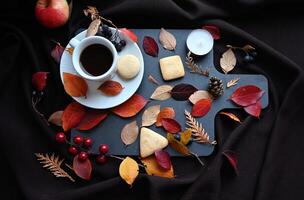 The rustic wooden tray is a perfect backdrop for the warm tones of the fall foliage and the sweetness of the cookies and apple. photo