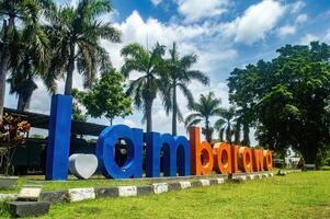 Ambarawa sign at the museum, a popular tourist spot in Central Java with palm trees and a clear sky. Indonesia, 17 November 2024 photo