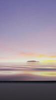 The sun is setting over the water with mountains in the background video