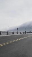 illuminated empty road bridge in a fog video