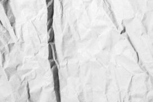 Crumpled light paper texture. Wrinkled surface, abstract background. photo