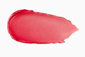 Matte red lipstick smear on a light white background. Cosmetic texture. photo
